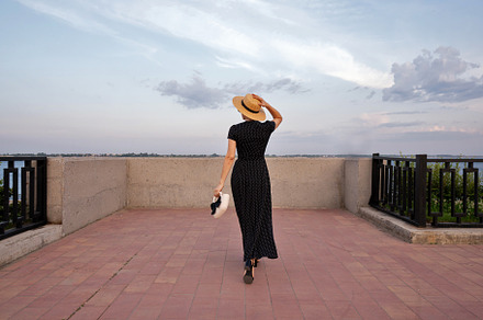 Woman in polka dot dress admires