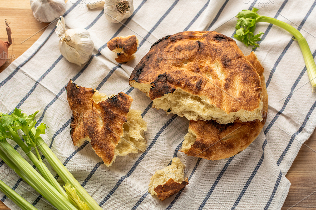 A stack of pita bread, garlic, onion, a Food & Drink Photo by Print Haven Mochi Vintage (Photo 1 of 2)