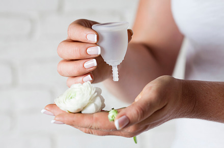 Menstrual cup in female hands stock photo containing alternative and care, a Health & Medical Photo by oksix