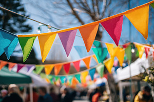 Colorful bunting over outdoor street market, a Holiday Photo by AlyaAnd