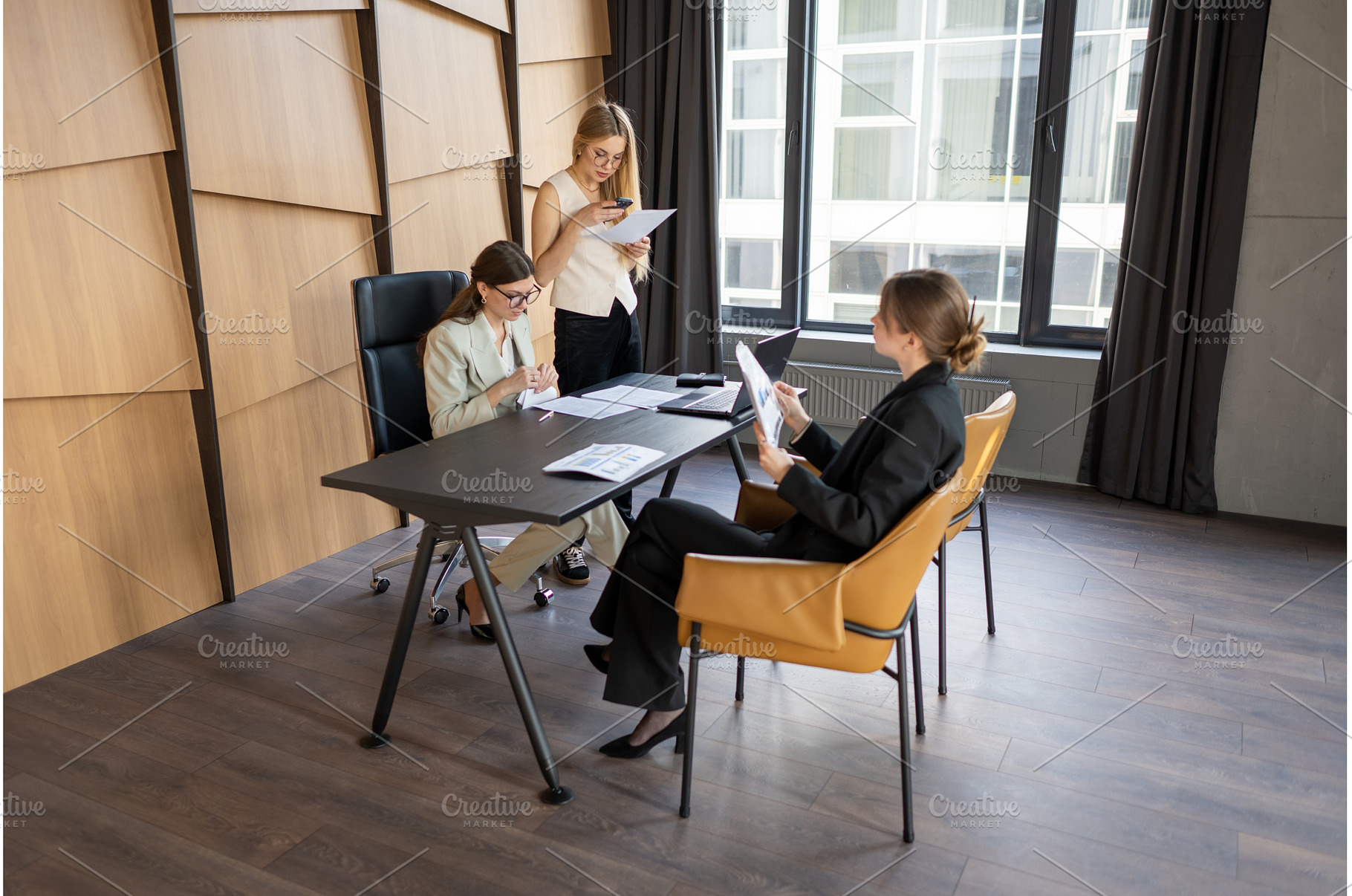 Female-led team managing a branding, a Business Photo by undrey