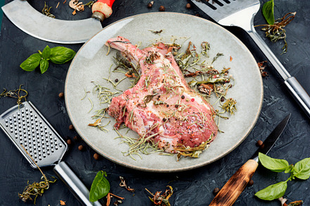 Raw chop steak Tomahawk marinated in, a Food & Drink Photo by MLunov MLunov
