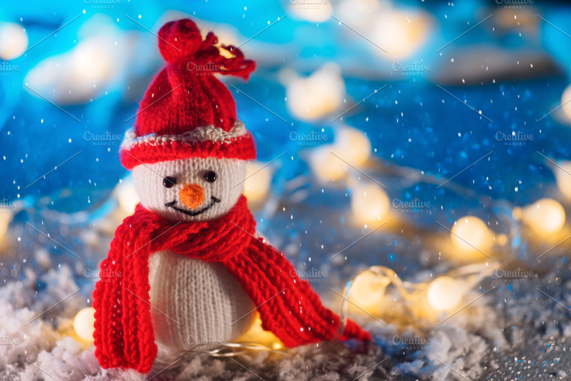 Funny knitted toy snowman. Christmas decor, fake snow decoration , bokeh garlan, a Holiday Photo by PavelKant