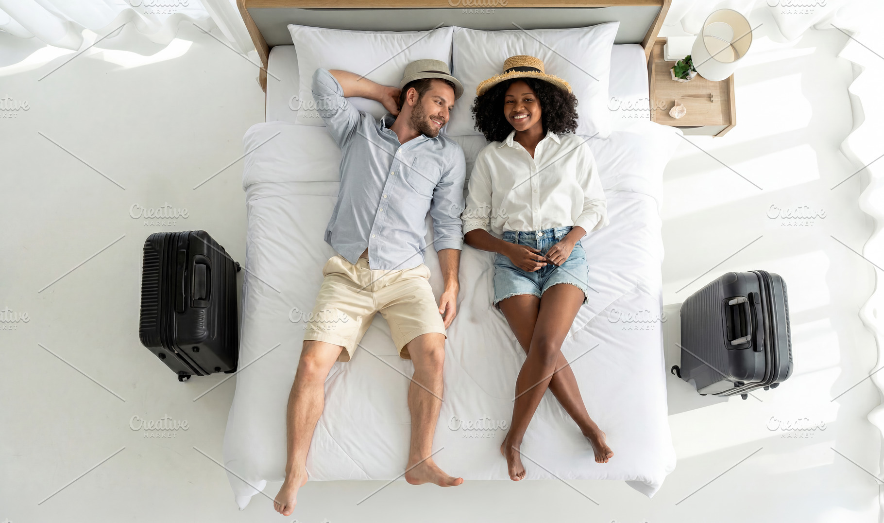 Happy Couple Relaxing on Bed with Suitcases, a Sports & Recreation Photo by Davizro's Market