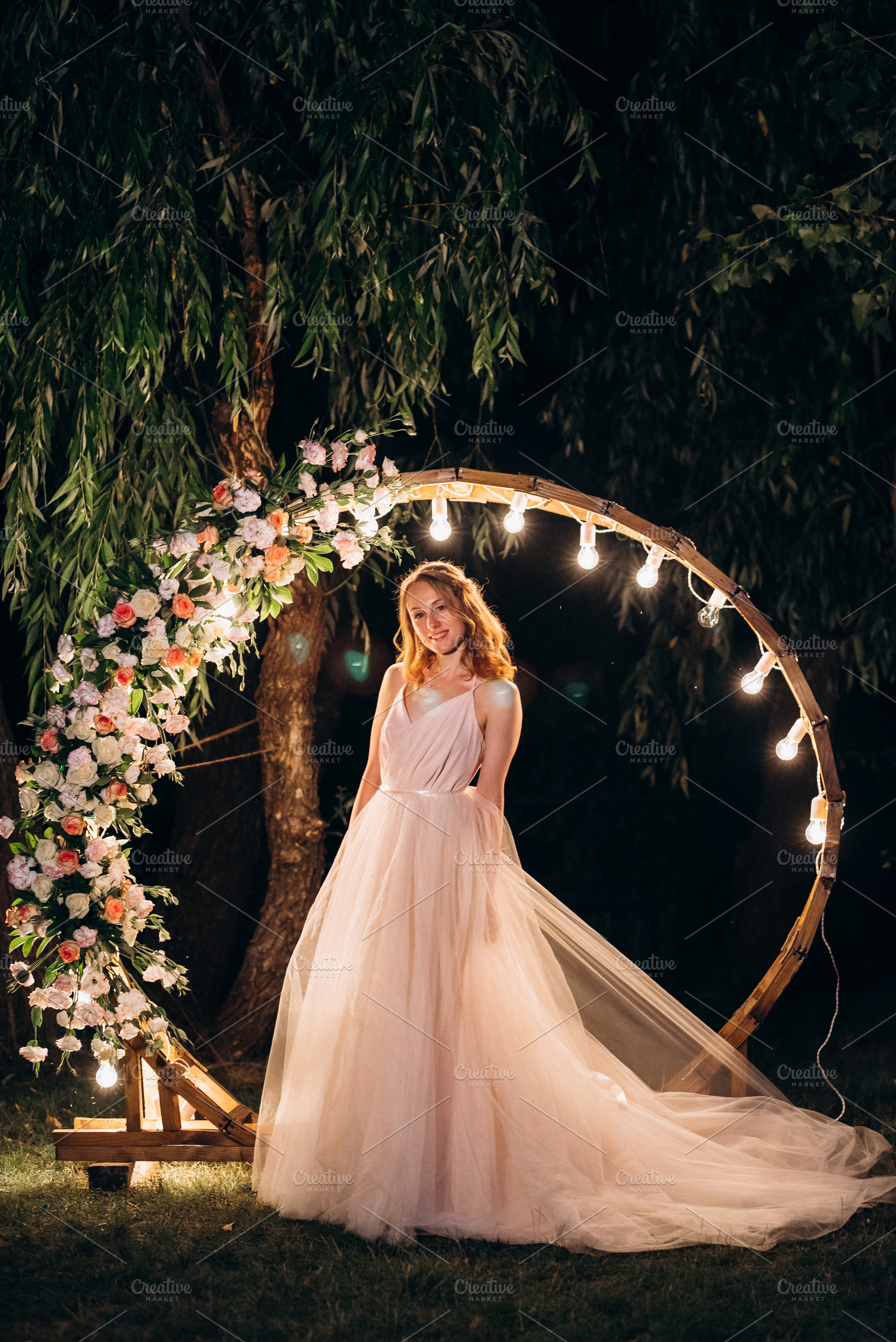 blonde bride in a light coral dress against the backdrop of an e, a Person Photo by Weddings, People, Travel