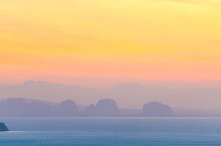 Mountain on sunset sea, a Nature Photo by Vapi