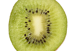 Slice kiwi fruit, isolated background. The vibrant green flesh w, a Food & Drink Photo by ndanko