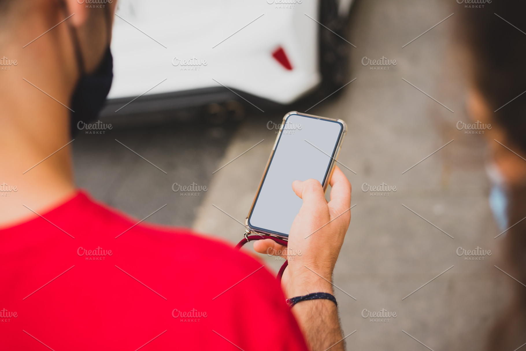 Mockup of a man using his smartphone, a Background Photo by rubenchase