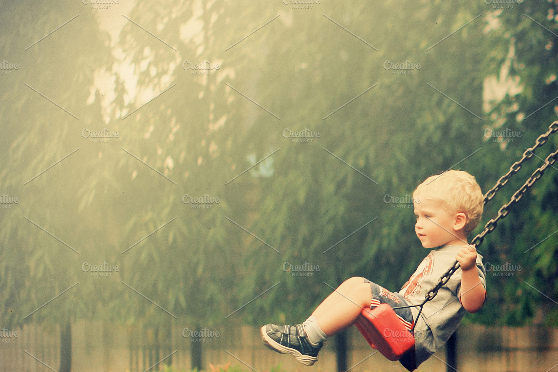 Boy on the swing containing kid, play, and playground