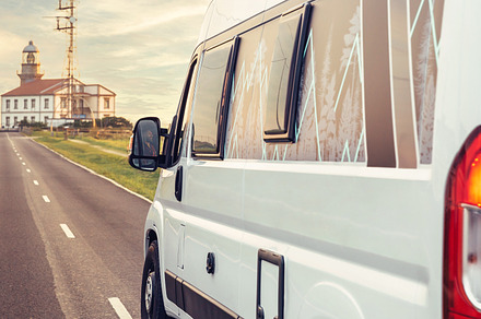 Closeup of camper van traveling to a lighthouse, a Transportation Photo by davidpereiras