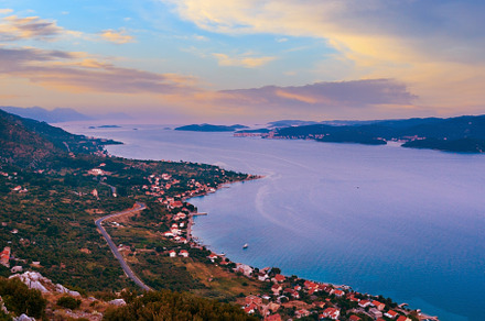 Sea sunset and village  on seashore (Pelješac  peninsula, Croat, a Nature Photo by YuriyB