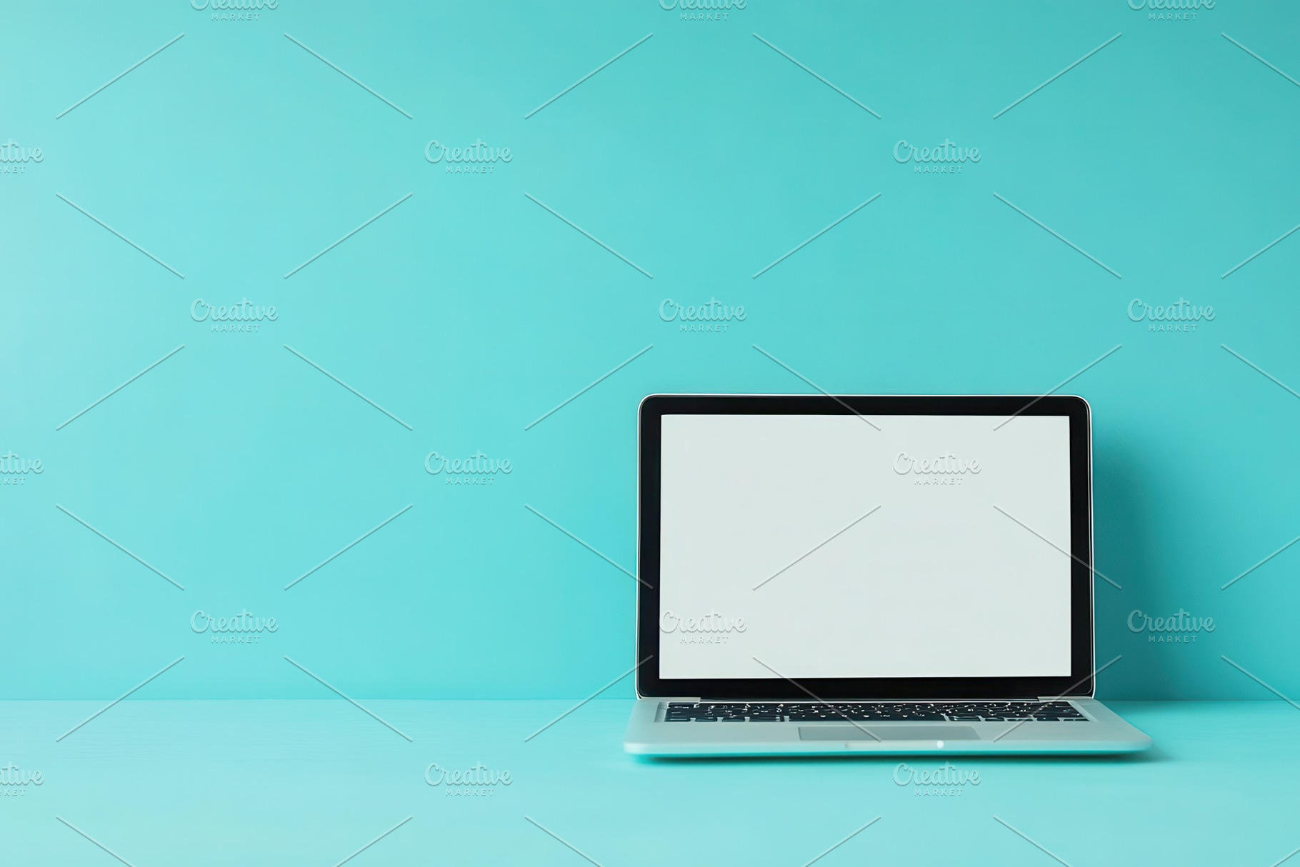 Open laptop computer sits on a blue, a Photo by Pavel_design