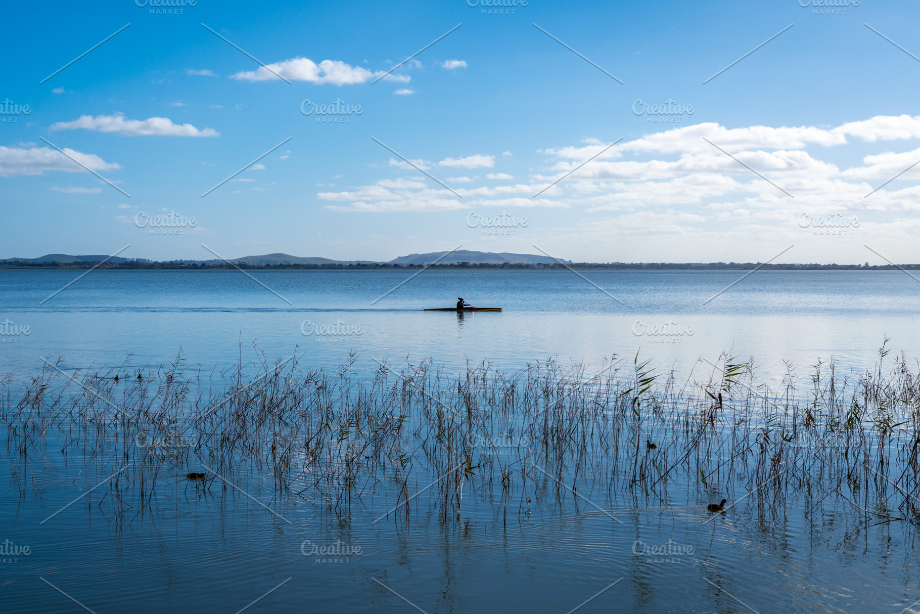 Kayaker paddling on Lake Colac, Victoria, Australia, a Nature Photo by GoodGoods