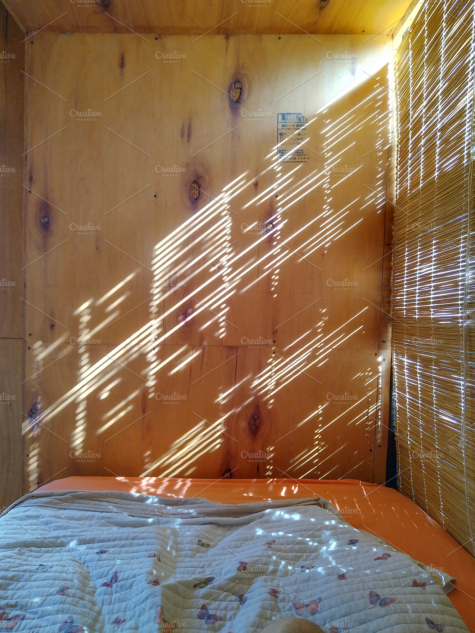 Cozy rustic wooden room with sunlight pattern, an Architecture Photo by DanFLCreativo