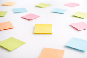 Colorful sticky notes scattered on white surface, concept of org, a Photo by Dvoevnore photos