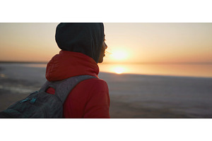 Rear view woman looking at sunrise