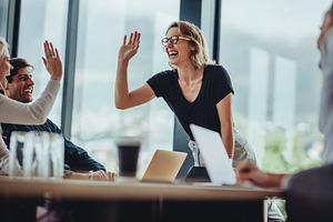 Business people high five, a Person Photo by Jacob Lund