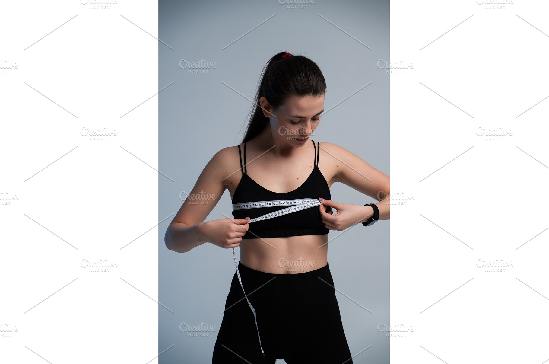 Woman measuring chest with tape, a Sports & Recreation Photo by volodymyrshtun13795