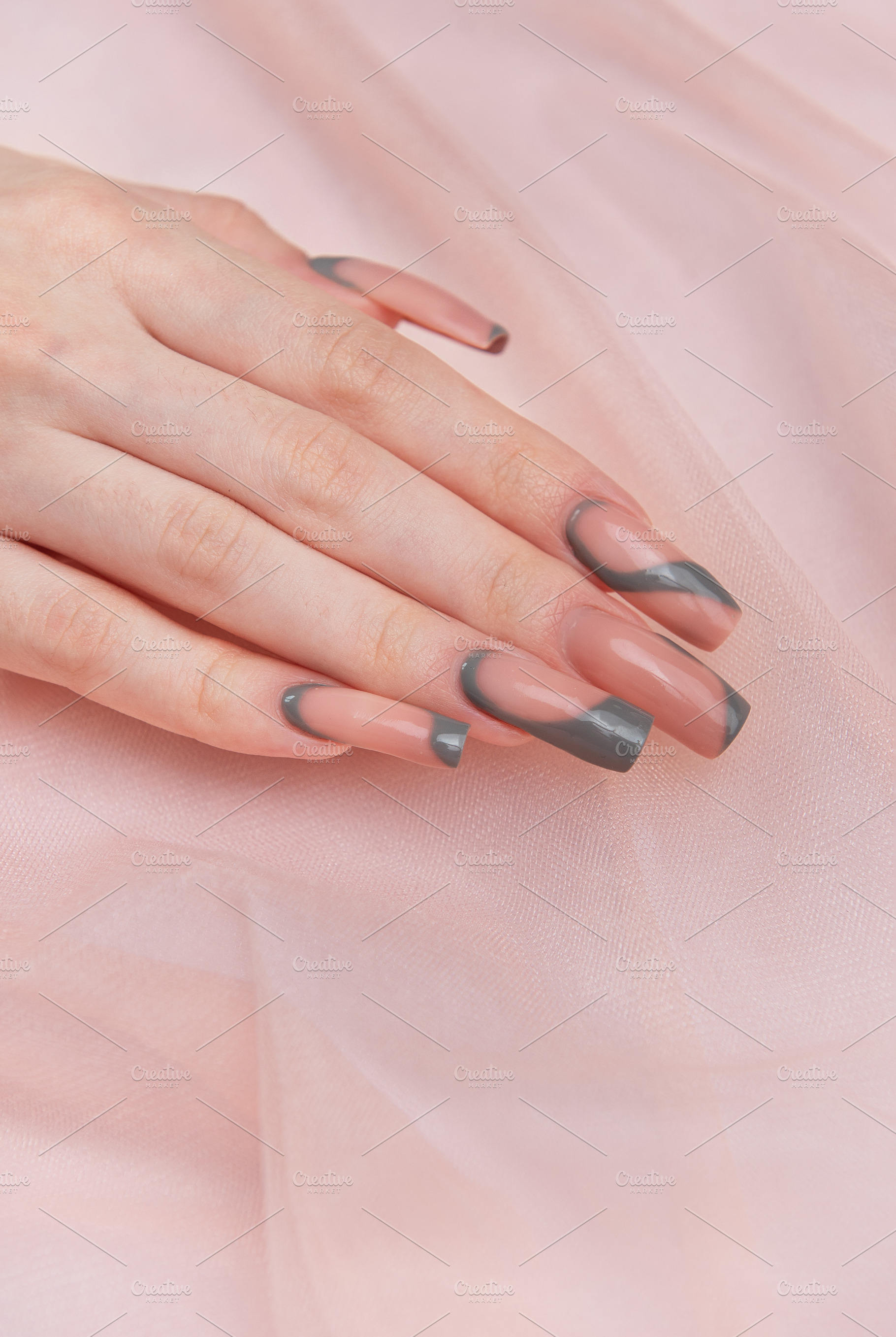 Female hand showing modern manicure with pink and grey nail art, a Beauty & Fashion Photo by Olena Rudo