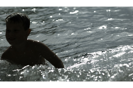The sea with a splashing boy, a Person Photo by Media Whale Stock
