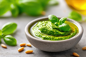 Fresh basil pesto in a bowl, a Food & Drink Photo by AlyaAnd