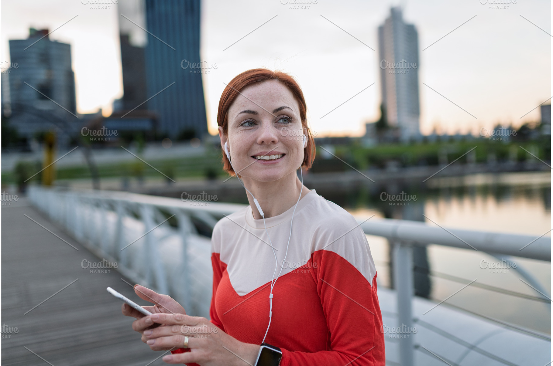 Runner playing music on a smartphone, a Sports & Recreation Photo by HalfPoint