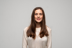 Young woman smiling, looking at, a Person Photo by volodymyrshtun13795