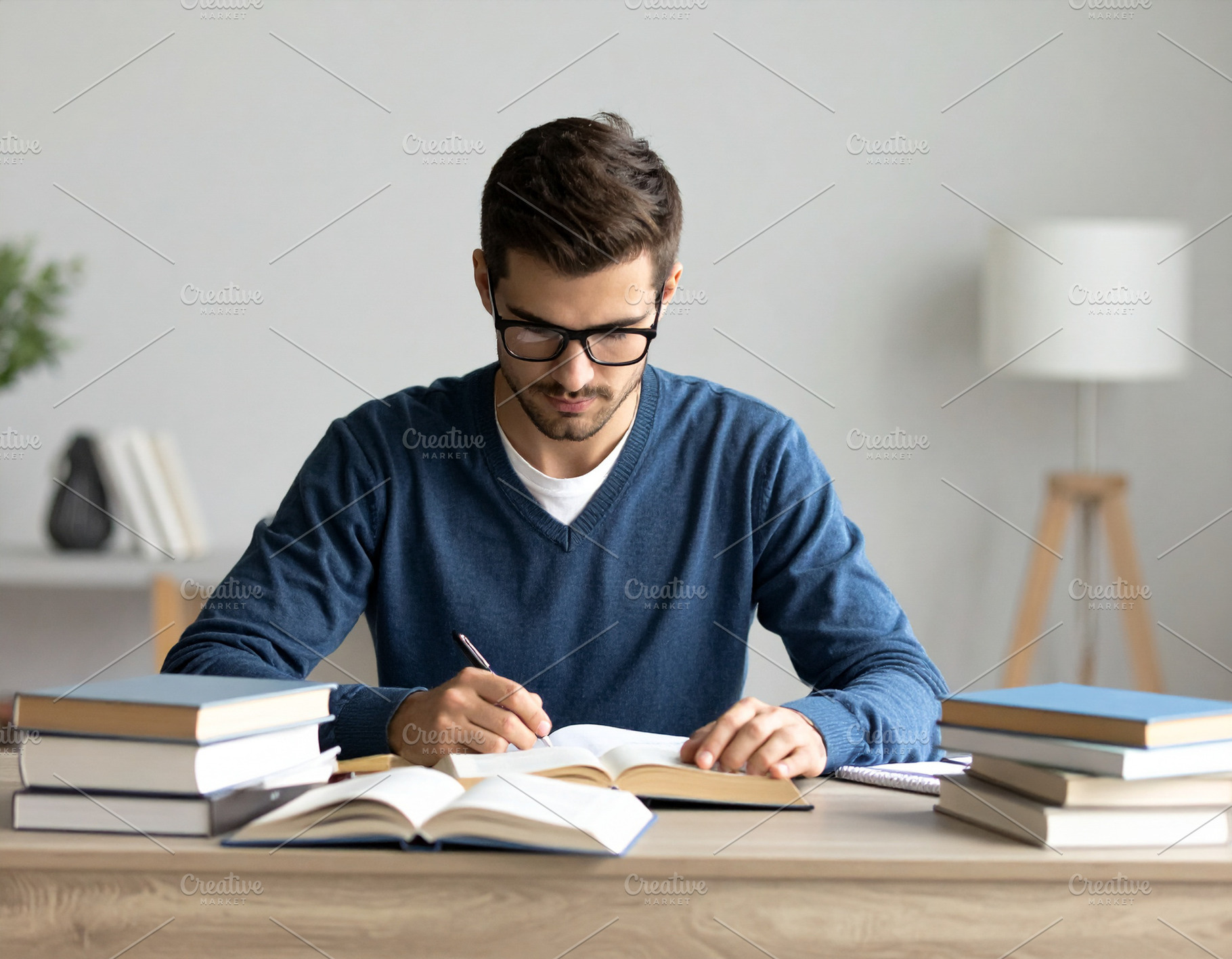 Student deeply concentrated on a book, surrounded by a calm and, a School & Education Photo by DanFLCreativo