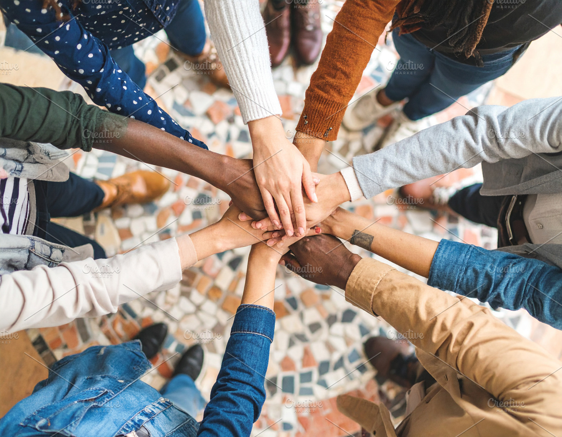 Hands assembling a mosaic of interlocking puzzle pieces, a Person Photo by DanFLCreativo