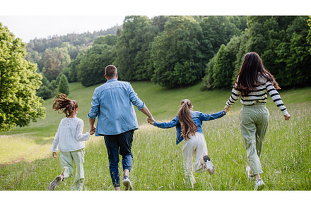 Rear view of beautiful young family, a Person Photo by HalfPoint