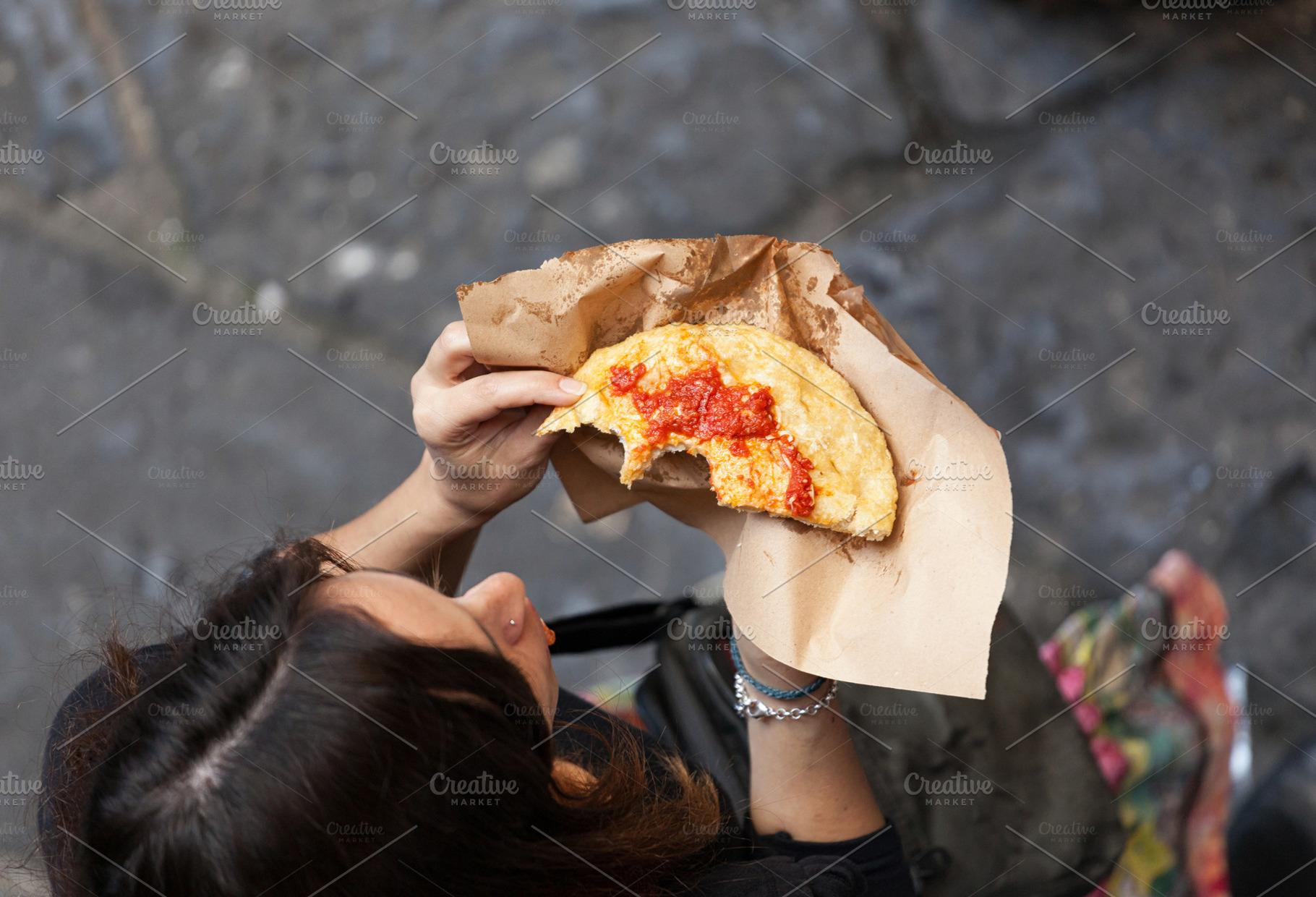 Woman photographed from above eating, a Photo by Antonio Gravante Market