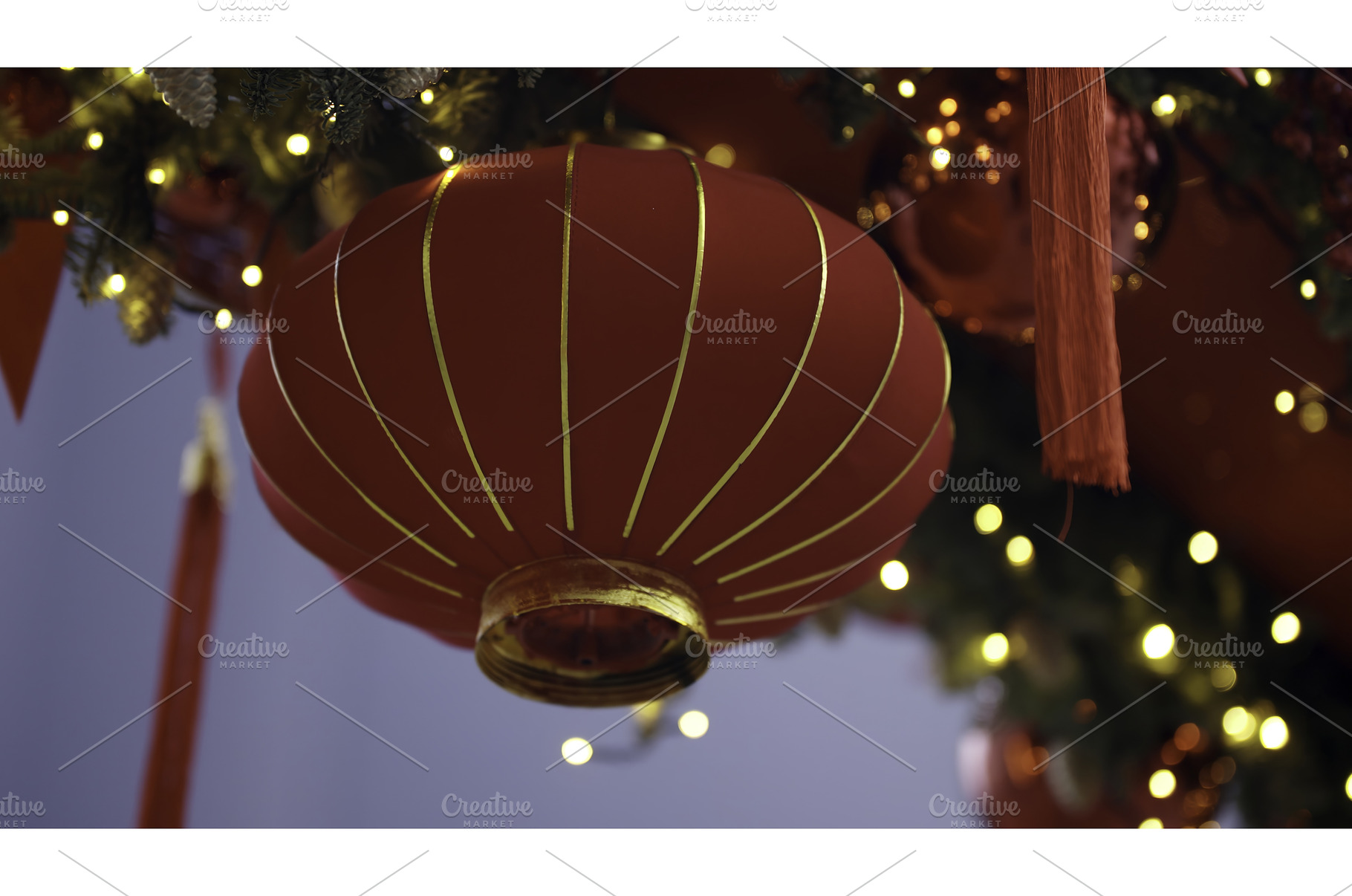 Red lanterns hanging, celebrating, a Holiday Photo by Media Whale Stock