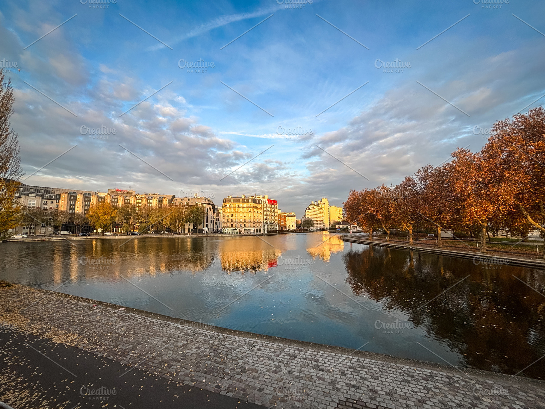 Wide sunset view of Ourcq canal in Paris France, an Architecture Photo by GoodGoods
