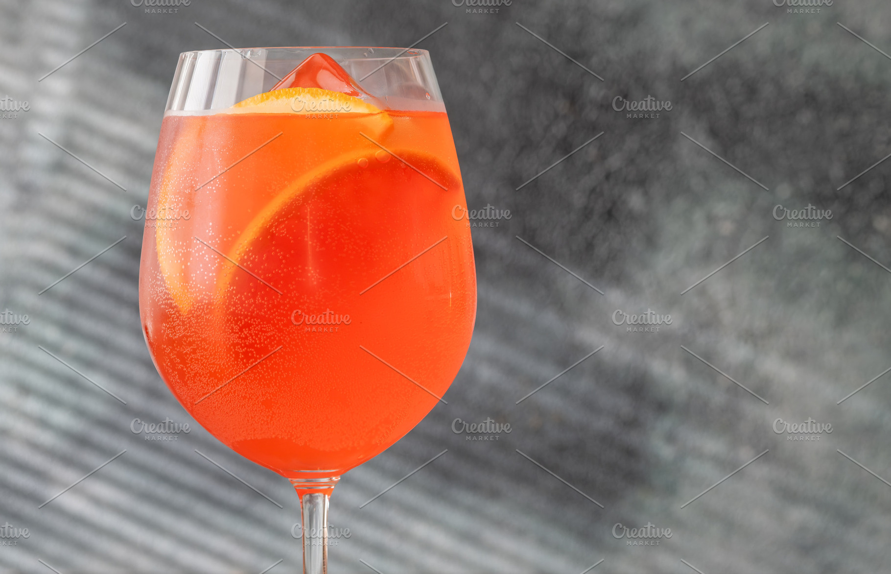 Vibrant Campari Spritz cocktail with citrus ice bubbles elegant, a Food & Drink Photo by Alexander Prokopenko