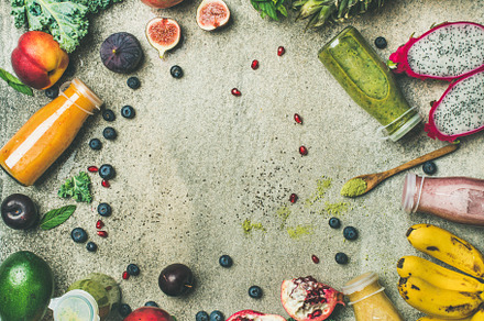 Colorful smoothies in bottles containing smoothie, juice, and fruit, a Food & Drink Photo by Foxys