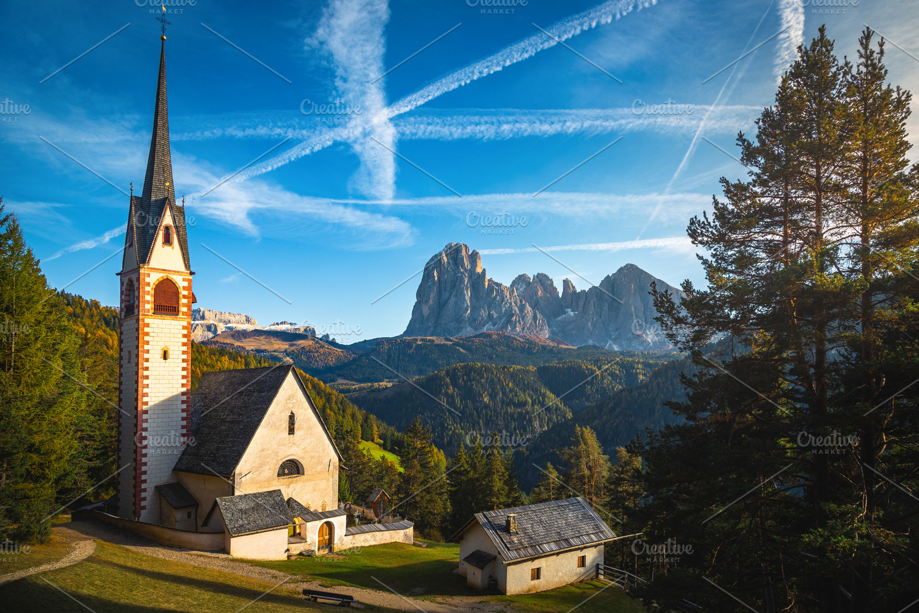 St Jakob church in the autumn forest, an Architecture Photo by Alpine Dreams
