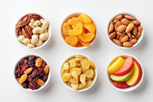 Bowls of mixed dried fruits and nuts, a Food & Drink Photo by AlyaAnd