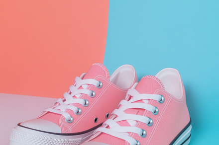 Pink sneakers on color background, a Photo by Dvoevnore photos