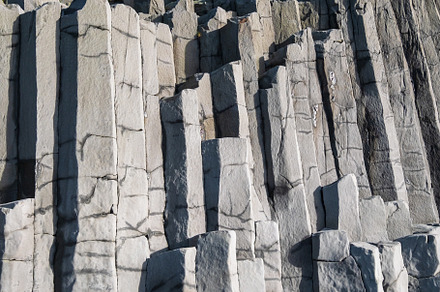 Basalt rock pillars columns at Reynisfjara beach near Vik, South, a Background Photo by YuriyB