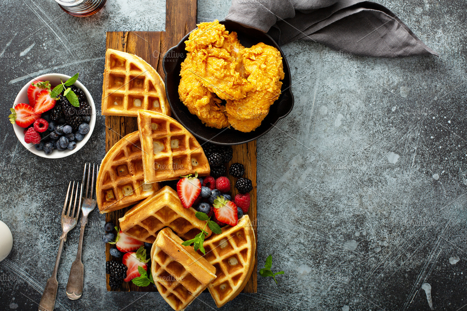 Breakfast platter with waffles, berries and chicken, a Food & Drink Photo by farwasser