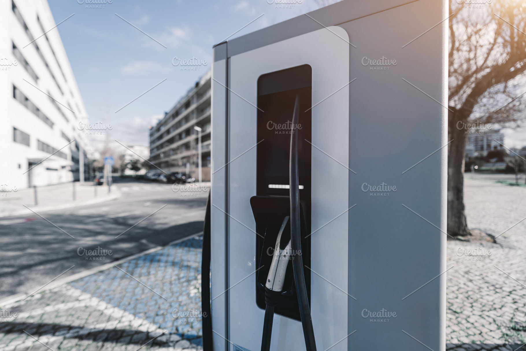 Electric vehicle charger outdoors, a Technology Photo by SkyNext