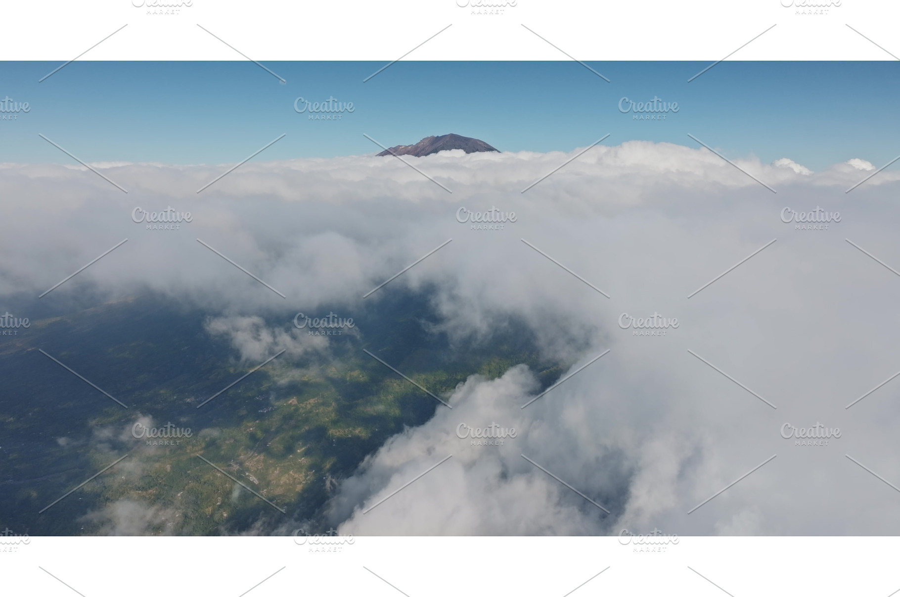 Mount Abang volcano peak emerging, a Nature Photo by Goinyk