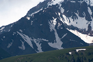 Vertical view of green hills and snowy Mount Kazbek slopes under, a Photo by Pictures for you!!!!!!!!!