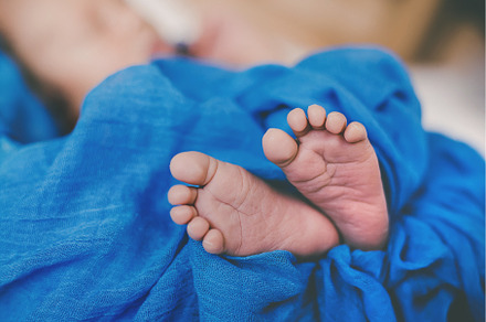 Newborn baby sleeping on a blue, a Person Photo by yanadjana