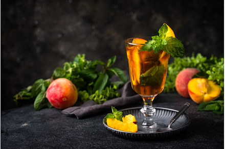 Cold ice tea with peach and mint, a Food & Drink Photo by Yulia Furman