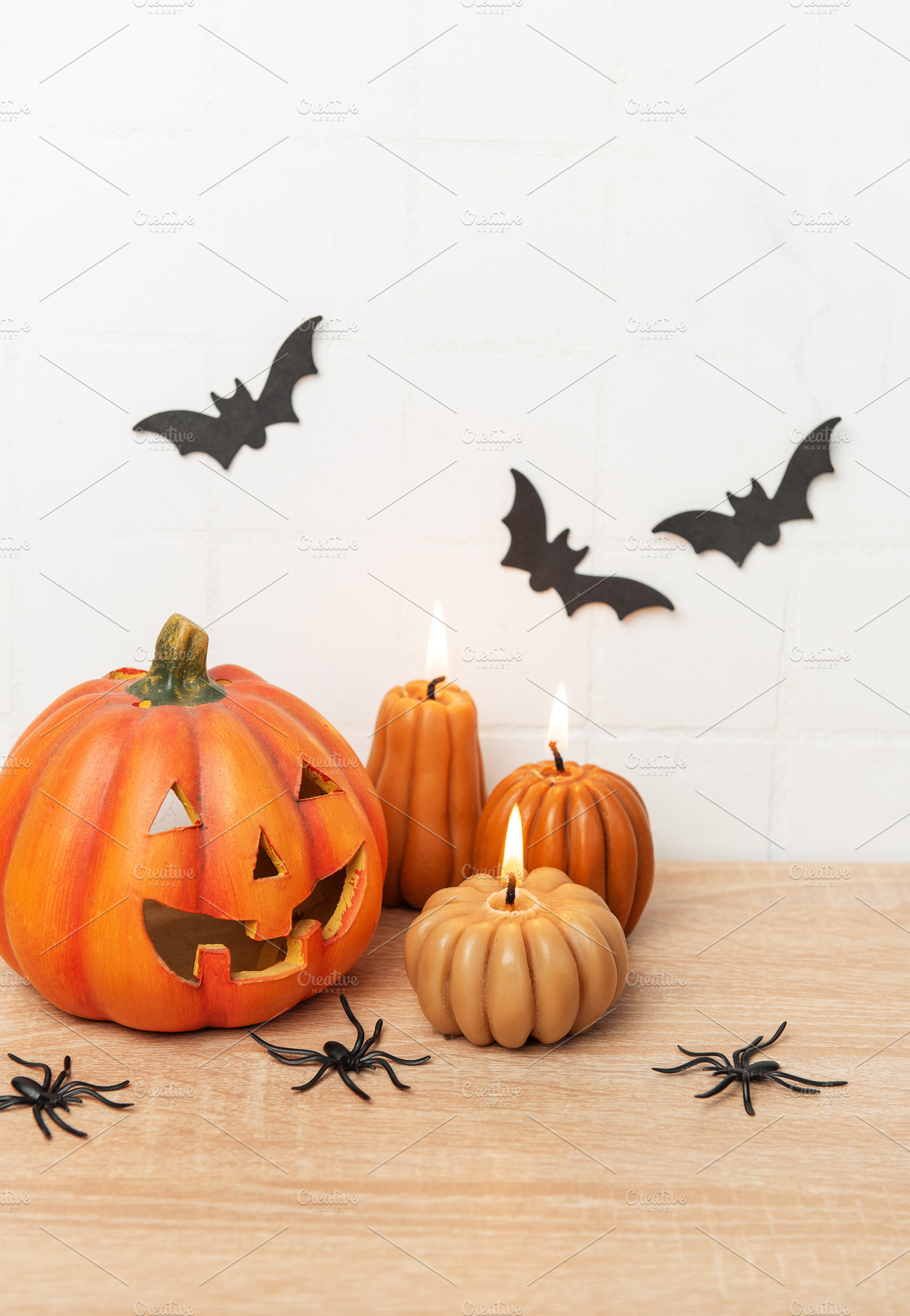 Halloween pumpkin jack o lantern with lit candles and spiders, a Holiday Photo by Olena Rudo