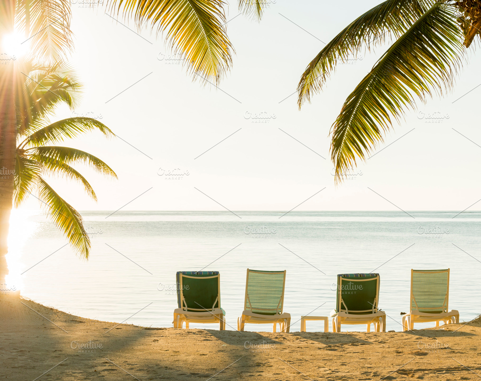 Sunset Over Tropical Beach Deckchairs, a Holiday Photo by THP Creative