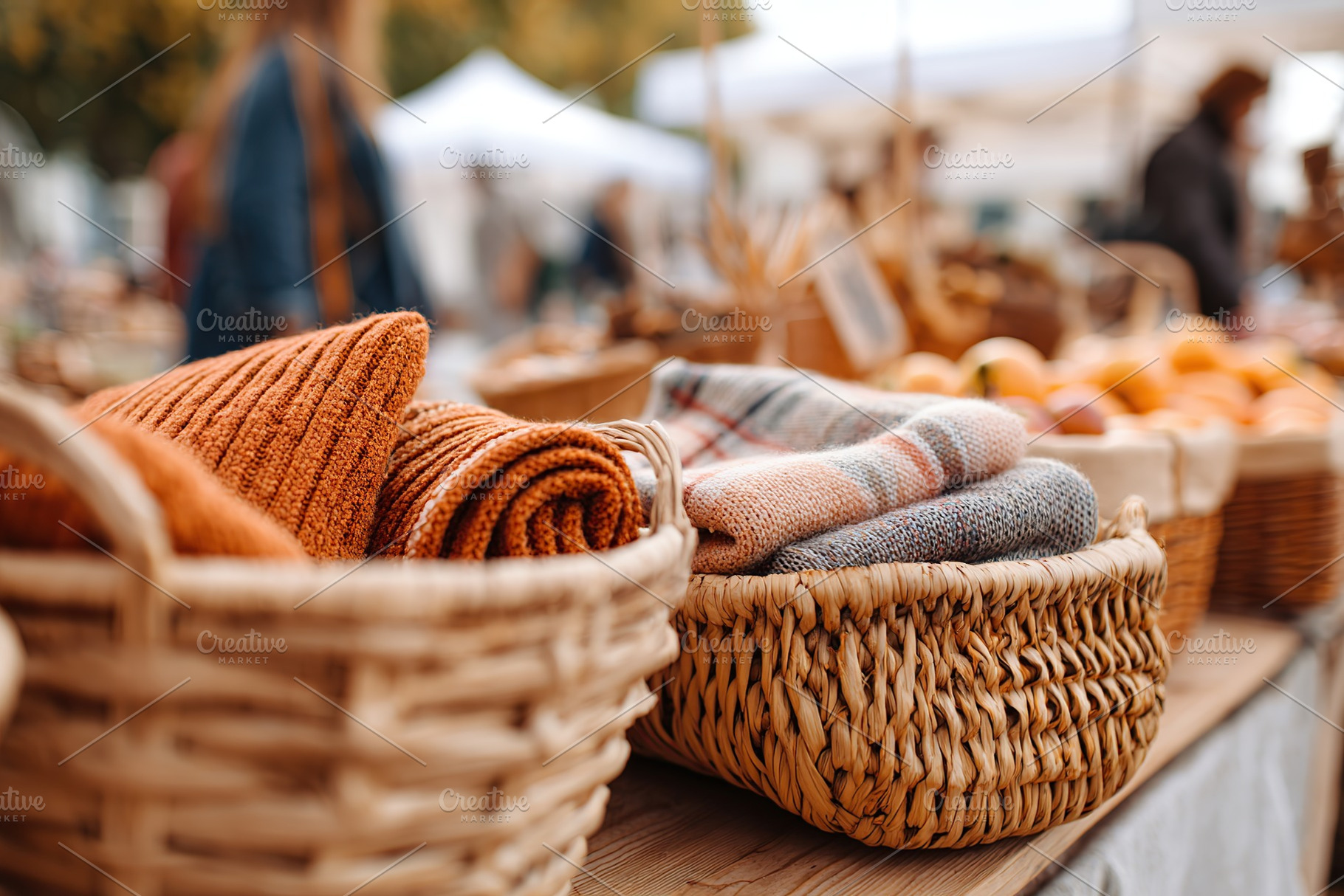 Cozy knitted textiles and handcrafted goods at a vibrant outdoor market in autu, a Photo by AlyaAnd