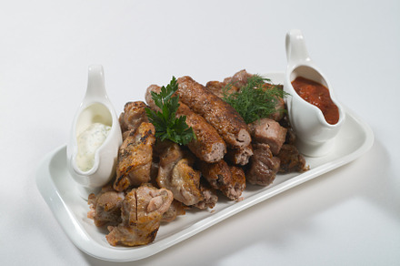 Roasted meat assortment with red and featuring meat, food, and meal, a Food & Drink Photo by oleghz