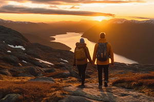 Couple Holding Hands While Hiking During Sunset in Mountainous Landscape, a Photo by AS photostudio